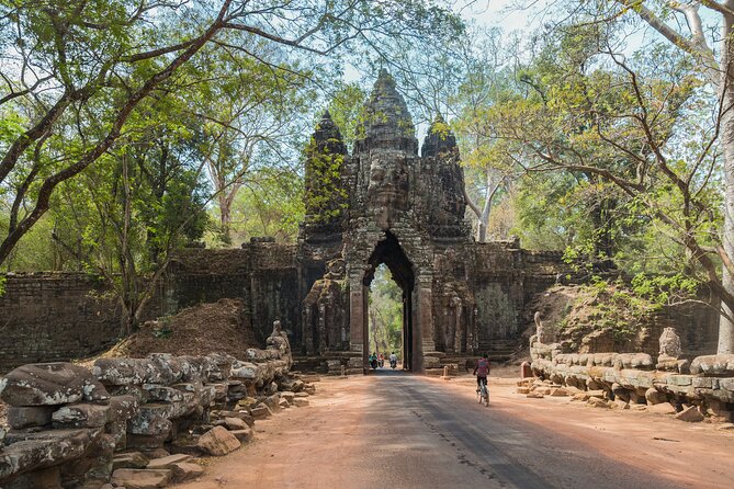 1-Day private Angkor Temple Tour by Tuk Tuk from Siem Reap - Angkor Thom’s South Gate and the stone faces of Bayon