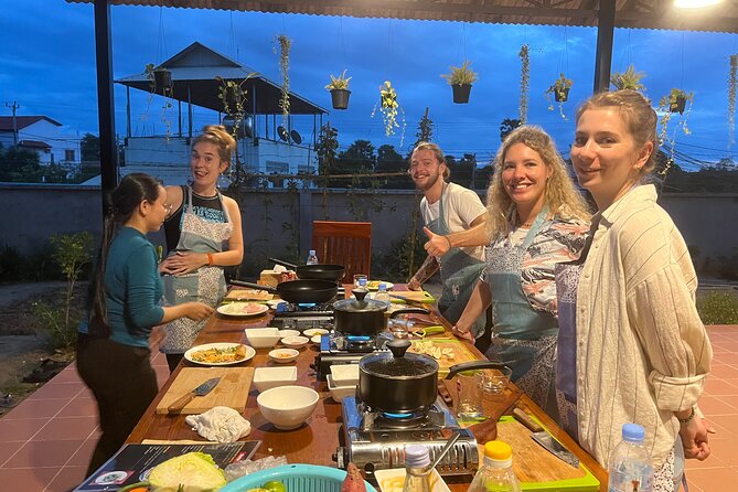 3-Hour Siem Reap Guided Cooking Class and Market with Pick up - Cooking in an open kitchen and garden setting