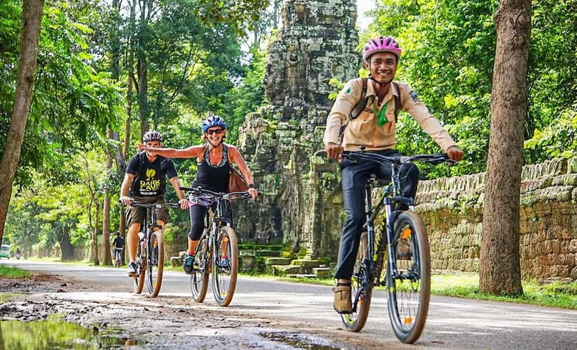 Angkor Bike tour & Gondola Sunset Boat - Rice fields, family plots, and the slower road