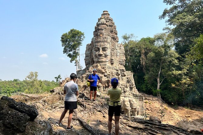Angkor Sunrise Bike Tour with Lunch Included - Cycling through Angkor Thom after the crowds begin
