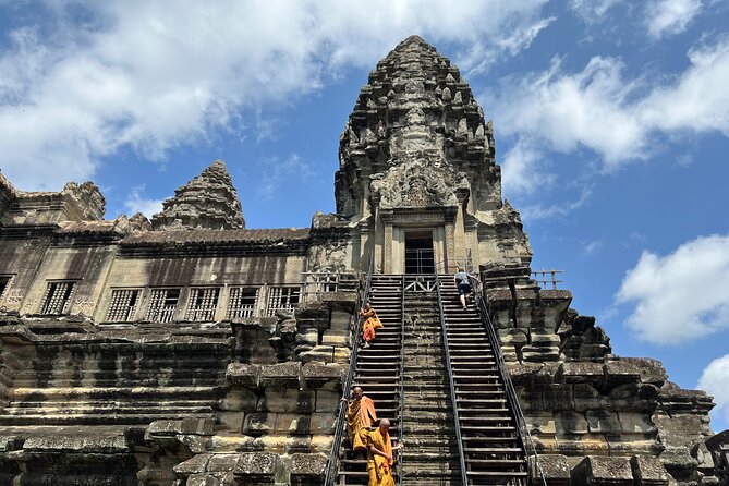 Angkor Sunrise Bike Tour with Lunch Included - Bayon Temple and its carved faces