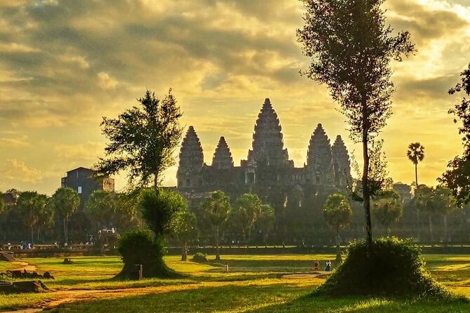 Angkor Sunrise Expedition Cycling Through Serene Backroads - Bayon’s Stone Faces