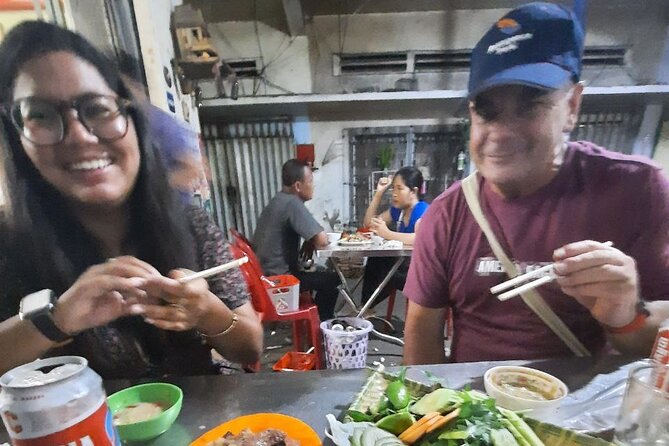 Authentic Walking Food Tour with Local Guide - Third tasting: coconut rice cakes from a cast-iron pan