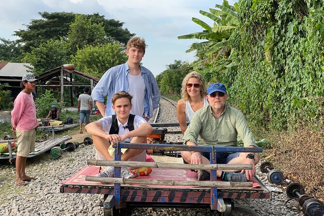 Full day tour by bicycle & tuk tuk,bamboo train,bat cave,villages - Cycling through villages and working Cambodia