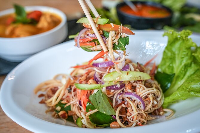 Old Siem Reap Sunset Food Tour by Tuk-tuk - Stop three: Phnom Krom, lotus fields, and a family meal