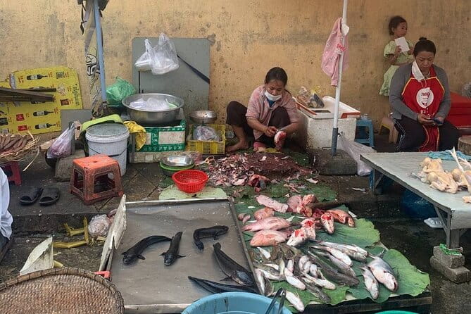 Phnom Penh Morning Breakfast, Market and Art Tour by Tuktuk - Stop three: produce, herbs, and Sister Mao at Ang Eng Market