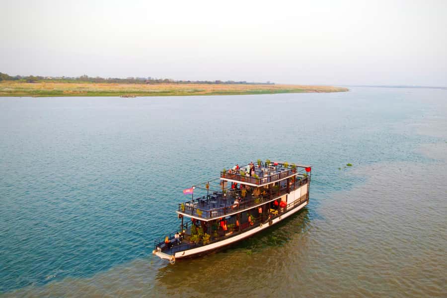 Phnom Penh: Sunset Cruise with Unlimited Beer &Fruit platter - The first 40 minutes: monuments, bridges, and river geography