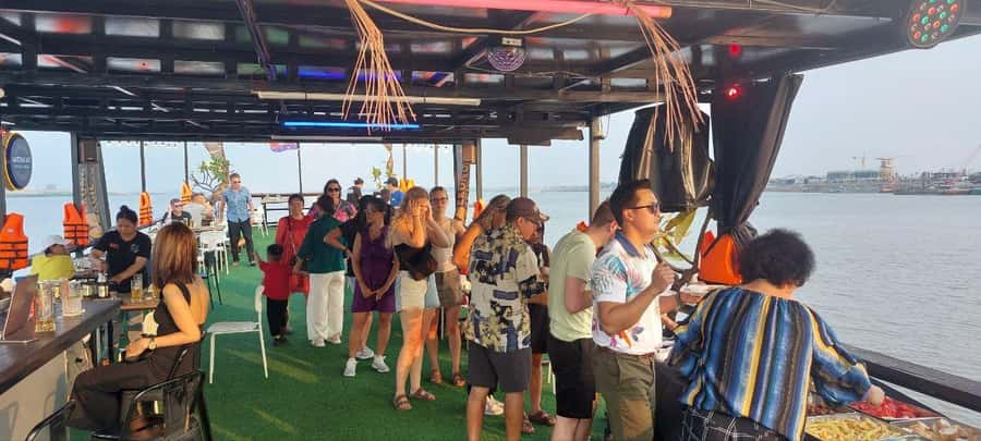 Phnom Penh: Sunset Cruise with Unlimited Beers & BBQ Buffet - Seeing Phnom Penh from the Mekong