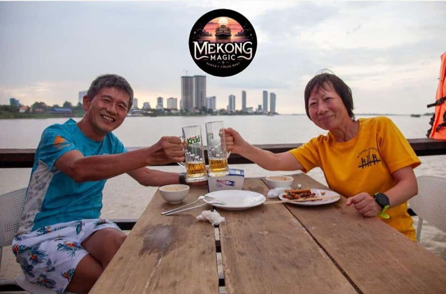 Phnom Penh: Sunset Cruise with Unlimited Beers & BBQ Buffet - The Diamond Island bridge and the Cambodian flag