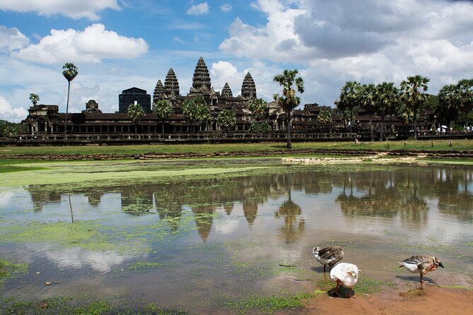 Private Sunrise Angkor Wat Tour with pickup from your hotel - Bayon’s many stone faces
