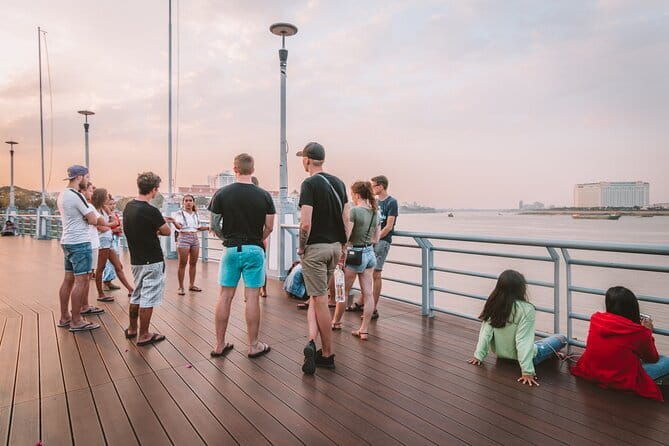 Riverside Walking Tour with Snack, Drinks & Local Ferry Ride - Royal Palace views and the first hour