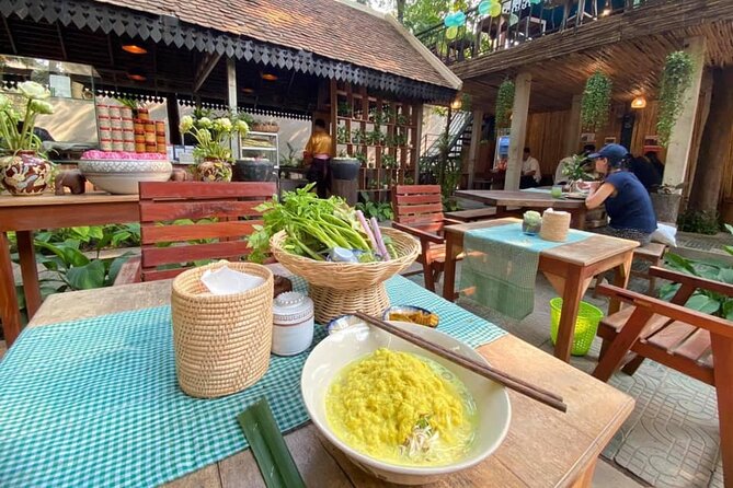 Siem Reap Evening Food Tour - Inclusive 5 stops Local Tastings - Stop three: herbs, spring rolls, fruit and BBQ snails