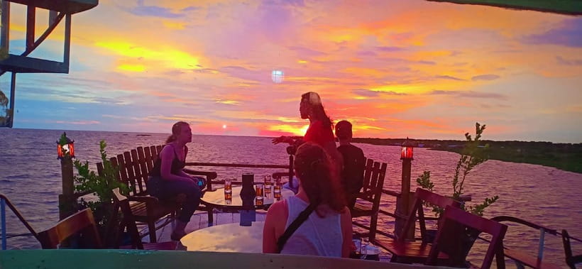 Sunset Dinner Tour: Tonle Sap Lake Floating Village - Cruising through a floating community