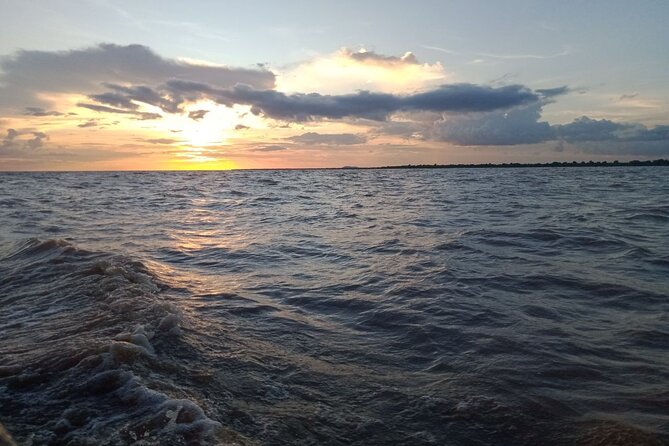 Sunset on Tonle Sap Lake - Boarding the boat on Cambodia’s great lake