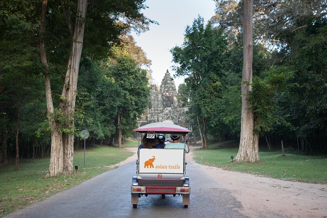 The Angkor Temples from Sunrise by Tuk Tuk - Angkor Thom and Bayon reveal a different royal city